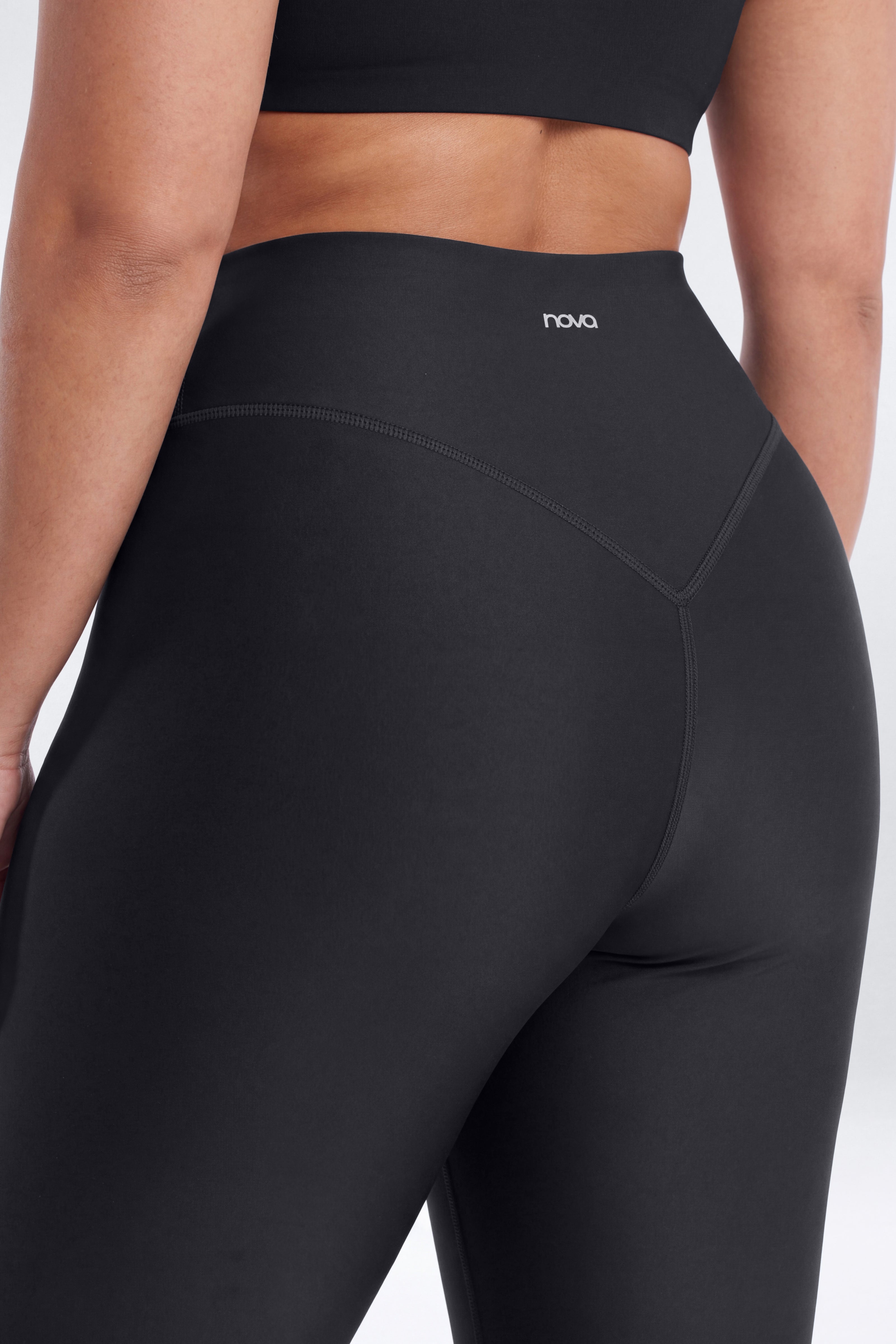 AirSculpt™ 35″ Tall Cross Front Mid Rise Flare Legging - Black
