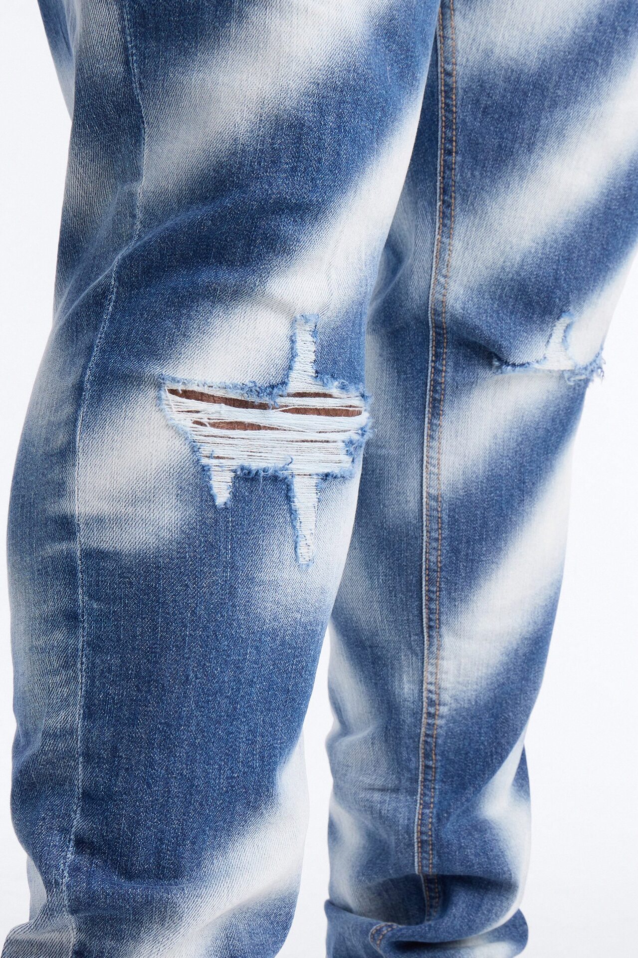 Stacked Skinny Vortex Distressed Jean - Medium Blue Wash