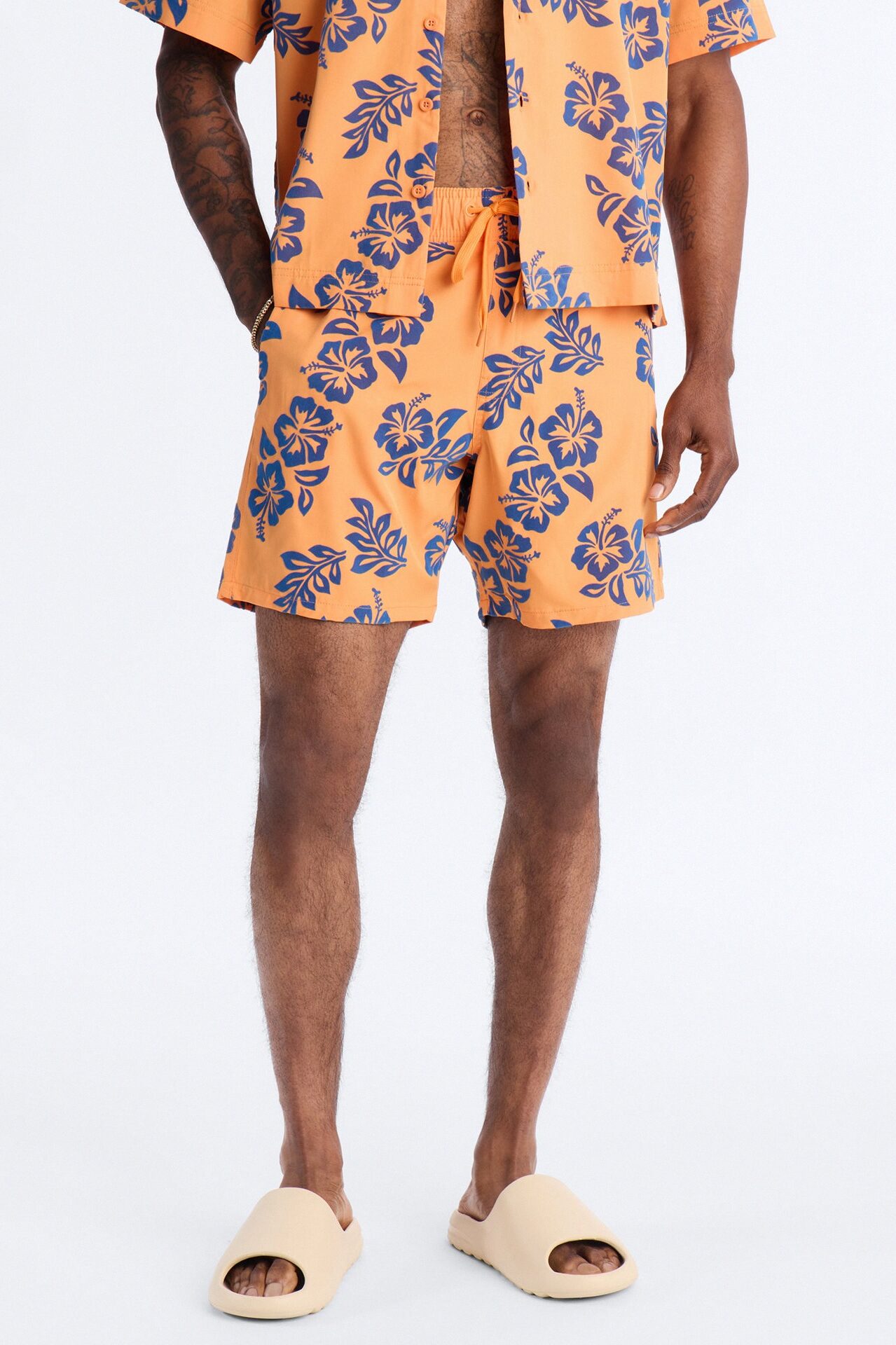 Flocked Hibiscus Heat Swim Trunk 7″ - Orange
