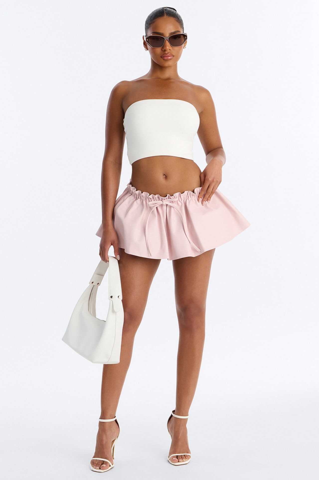 I'm A Flirt Pleated Faux Leather Peekaboo Micro Skort - Light Pink