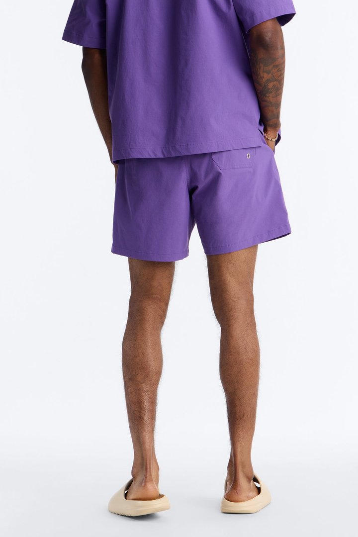 Montez Stretch Swim Trunk 7″ - Purple