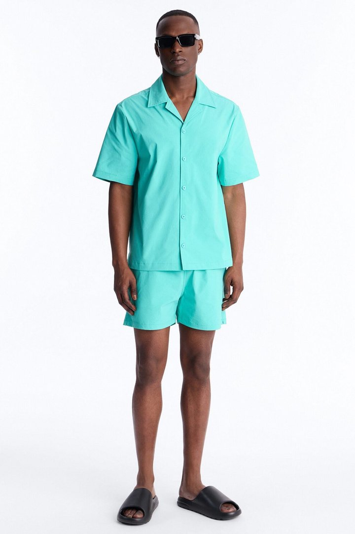 Montez Stretch Swim Trunk 4″ - Teal