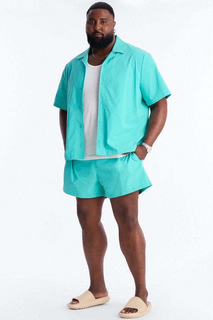 Montez Stretch Swim Trunk 4″ - Teal