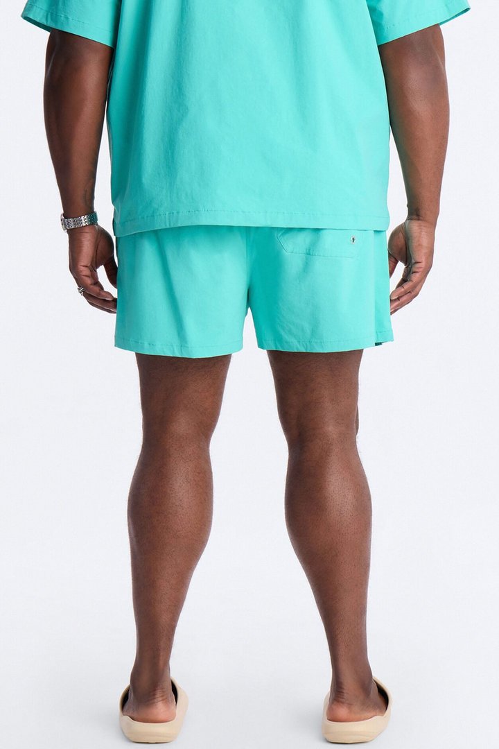 Montez Stretch Swim Trunk 4″ - Teal