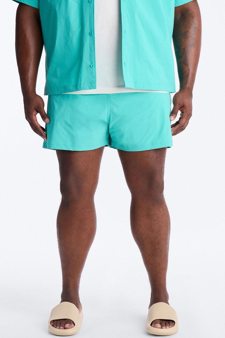 Montez Stretch Swim Trunk 4″ - Teal