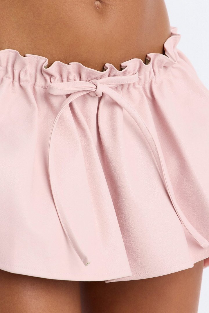 I'm A Flirt Pleated Faux Leather Peekaboo Micro Skort - Light Pink